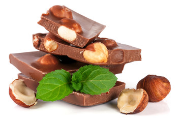 Chocolate with hazelnut and mint leaf isolated on white background