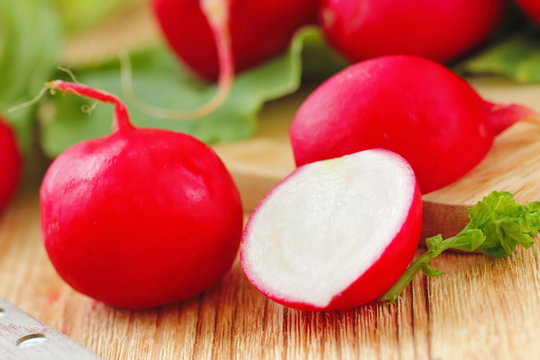 Fresh radishes on wooden table