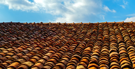 Old clay ceramic roofing tileagainst sky