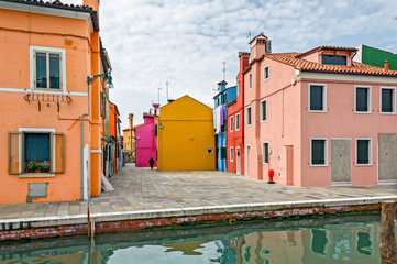 The colored houses on the shore of the channel - Burano, Venice, Italy