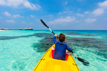 Teenage boy kayaking