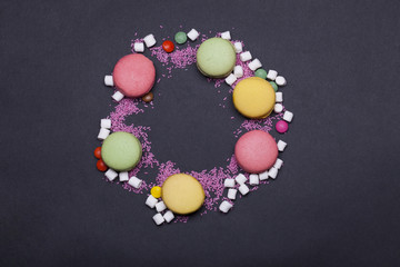 colorful macaron, dragee sweets, marshmallow, zephyr and sprinkles
