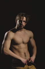 Fototapeta na wymiar Handsome man with naked, muscular torso with six packs