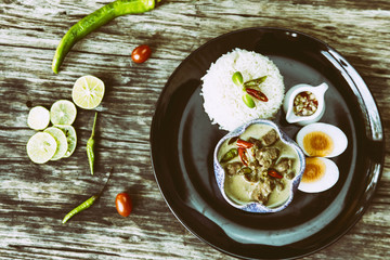 Asian food. Pork Curr Seasoned With Bird Pepper With Rice on wooden background