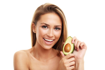 Portrait of attractive adult woman with avocado isolated over white background