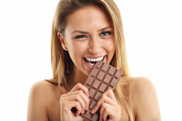 Portrait of beautiful woman holding chocolate bar