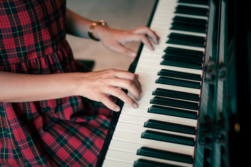 Fototapeta premium woman hands playing piano