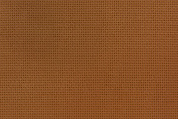 Texture of the brown flax fiber. Fabric of natural raw material.