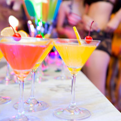 Group of colorful cocktail in martini glasses.