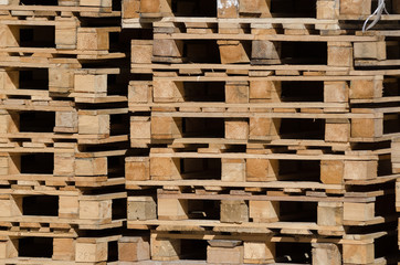 Stacked wooden pallets on a storage site