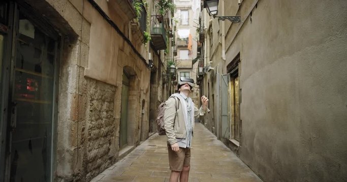 Tourist Man walking Barcelona streets wearing virtual reality headset exploring local travel watching 360 video imagination concept