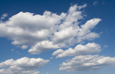 Heavy rain clouds in the blue sky
