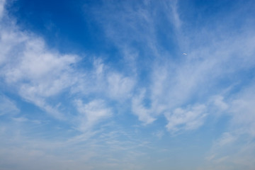 Heavy rain clouds in the blue sky