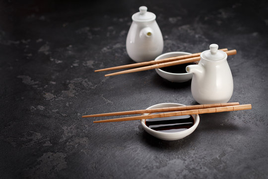 Japanese cuisine. Set for sushi. Chopsticks. Soy sauce. Stone background.