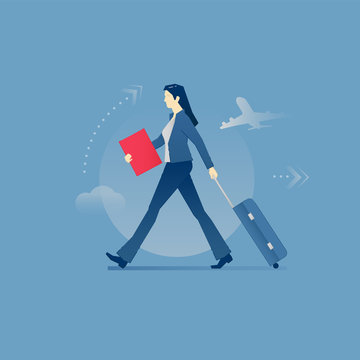 Young business woman carrying a luggage in business travel
