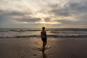 A girl walking on the beach
