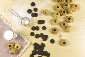 Small donuts on wood background - top view