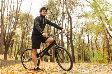 Man on bicycle in park
