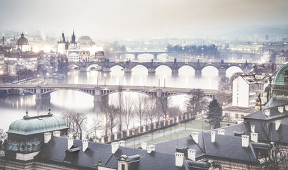 Prague and Vltava river from Letna Hill - Romantic view after misty sunset with emotional foggy...