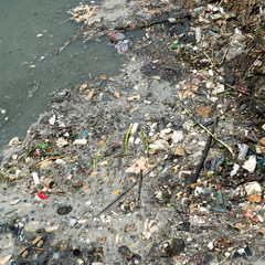 Water pollution in river with trash.