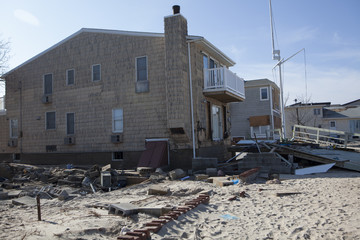 Obraz na płótnie Canvas NEW YORK -November12:Destroyed homes during Hurricane Sandy in the flooded neighborhood at Breezy Point in Far Rockaway area on November12, 2012 in New York City, NY