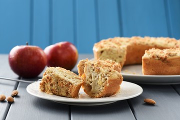 Homemade appetizing wholegrain almond cake with fresh red apples