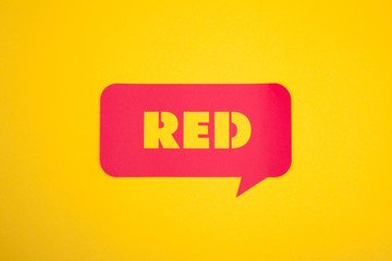 The cardboard bubble with red word