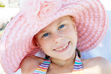 Portrait of a little girl in a hat in summer © natasnow