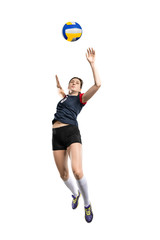 Female volleyball player hitting the ball