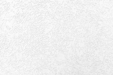 white wall with a pattern on the plaster. Texture background