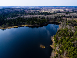 Naklejka premium drone image. aerial view of rural area with forest lake