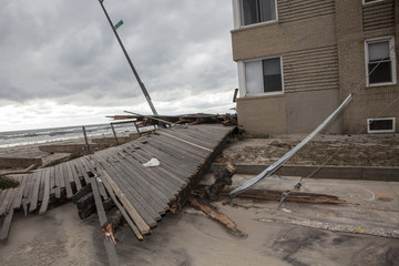 Fototapeta na wymiar NEW YORK - November 1: Large section of the iconic boardwalk was washed away during Hurricane Sandy in Far Rockaway area October 29, 2012 in New York City, NY