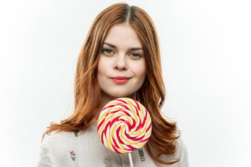 sweet candy, round lollipop in a woman's hand