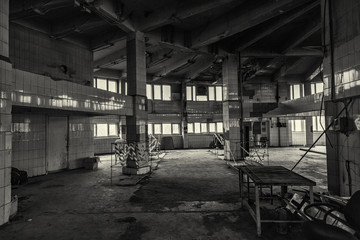 Inside an abandoned deserted cluttered industrial building