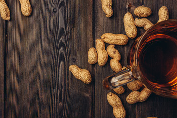 peanuts and a cup with a drink...