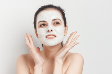 exquisite woman with a white mask on her face