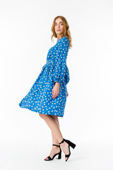 Young elegant female in light summer dress, over white background