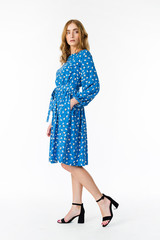 Young elegant female in light summer dress, over white background