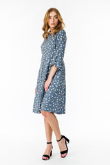 Young elegant female in light summer dress, over white background