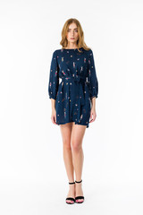 Young elegant female in light summer dress, over white background