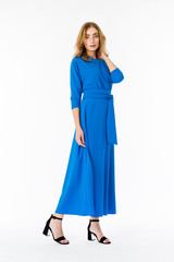 Young elegant female in light summer dress, over white background