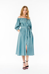 Young elegant female in light summer dress, over white background