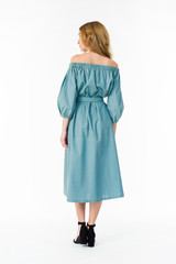 Young elegant female in light summer dress, over white background