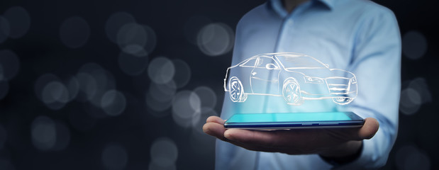 Businessman hand phone with car on bokeh  background