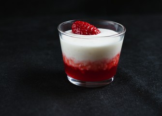 Strawberry flavored tapioca pudding on black background