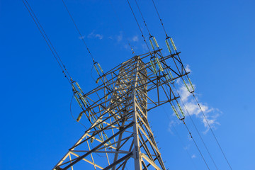 A power transmission line on a blue sky background