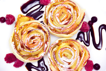 apple muffins with raspberries and  blueberries and chocolate sauce