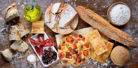 Focaccia with cherry tomatoes and olives, bread, white focaccia, dried tomatoes and olives