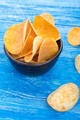potato chips in a clay plate