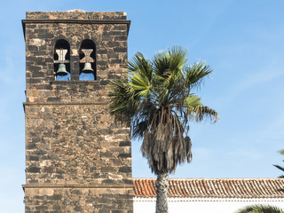Campanile of Church Iglesia de Nuestra Señora de la Candelaria in the historic town La Oliva...